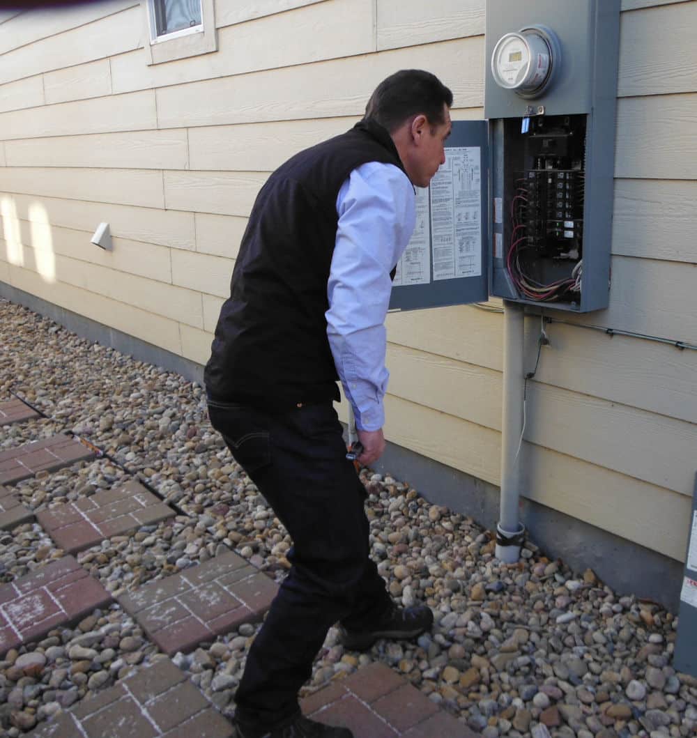 ashi certified home inspector duane younger inspecting a breaker box during a builder's warranty inspection