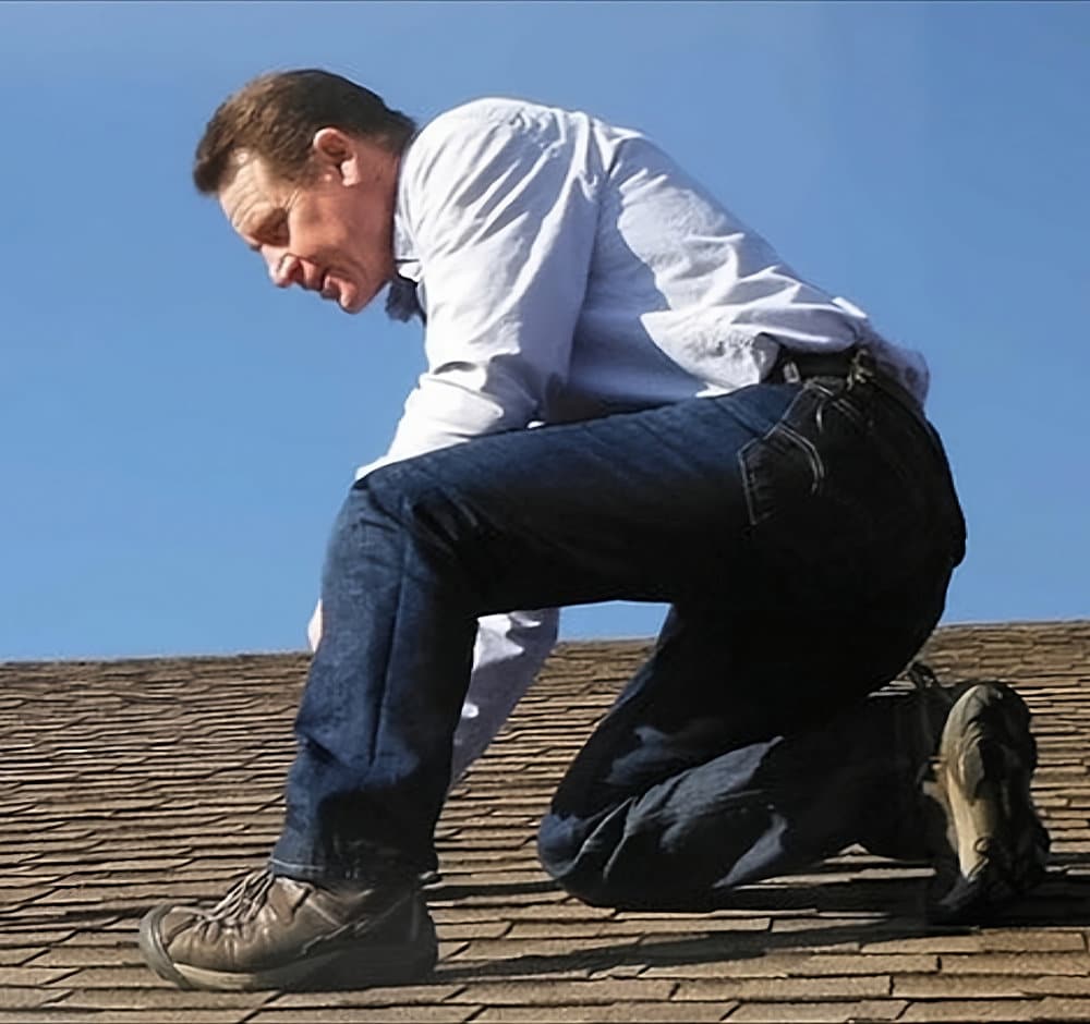 home inspector duane younger inspecting a roof