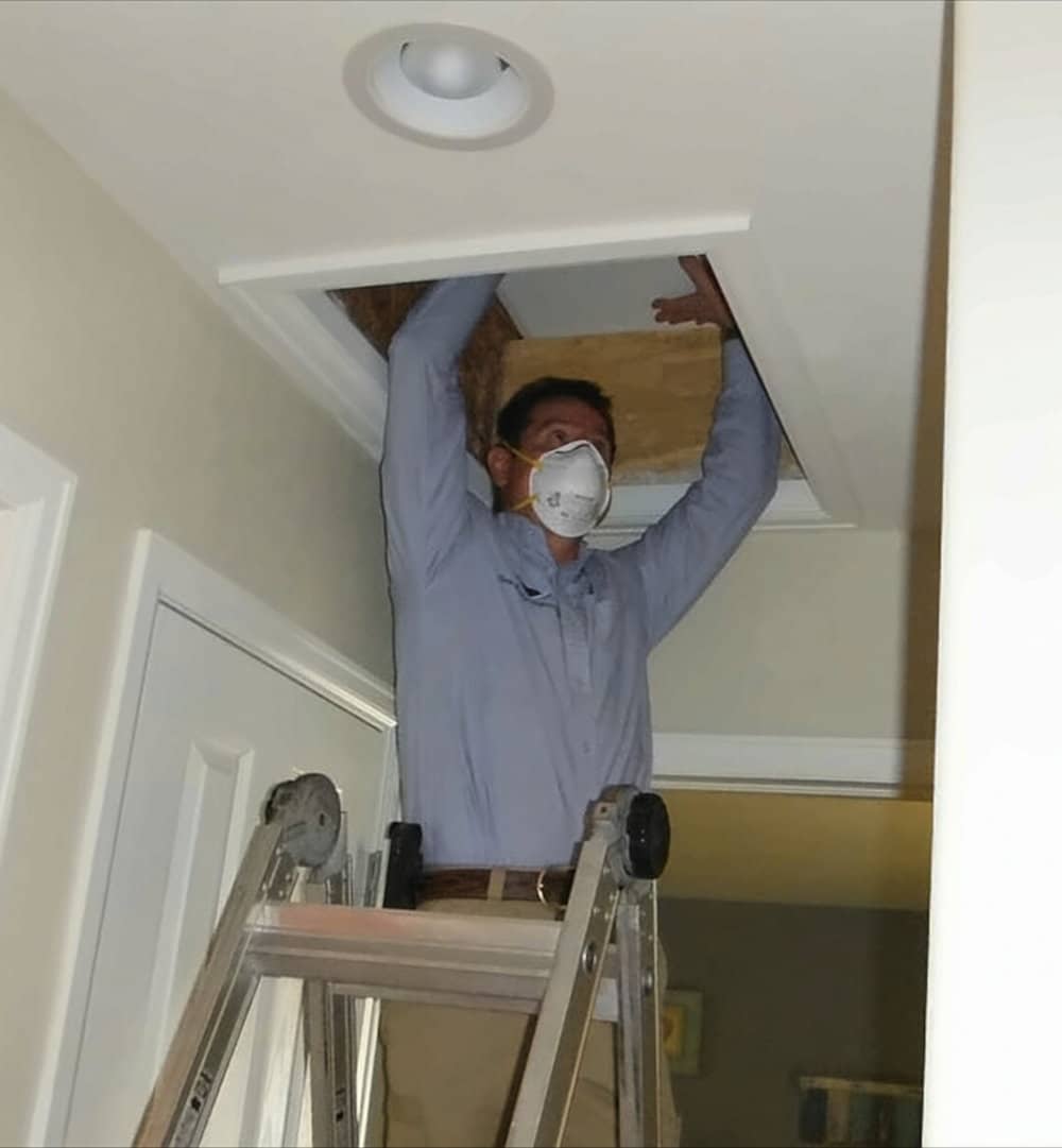 denver home inspector duane younger inspecting a attic during a new construction inspection.